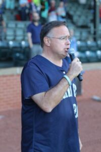 Dr. Custer sings national anthem